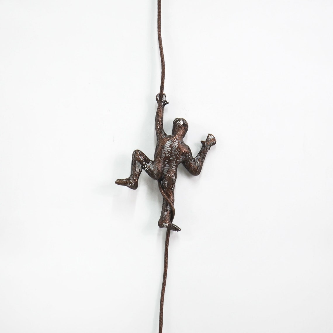 Miniature metal sculpture Climbing man on the rope Wall | Etsy