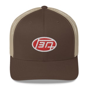 May include: A brown and beige trucker hat with a red and white embroidered Toyota logo.