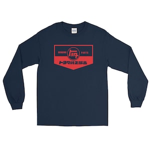 May include: A navy blue long-sleeve t-shirt with a red and white logo that says "Genuine Toyota Parts" in English and Japanese.