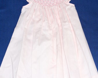 Smocked bishop style dress embroidered in pink