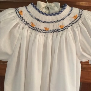 Hand-smocked bishop dress with ducklings. Great for Easter, parties, spring and summer.