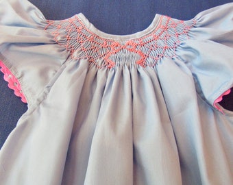 Hand smocked bishop style dress with angel sleeves