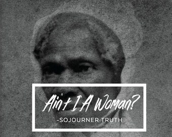 May include: Black and white framed print featuring a portrait of Sojourner Truth. The image includes the text "Ain't I A Woman?" and "-SOJOURNER TRUTH" in a white rectangular box. The portrait is in grayscale.