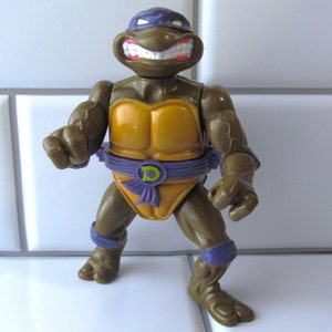 1990s TMNT Donatello Figure With Storage Shell  - Teenage Mutant Ninja Turtles