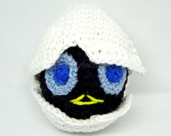 Black chick in egg shell with cotton hook; inspired by Calimero cartoon