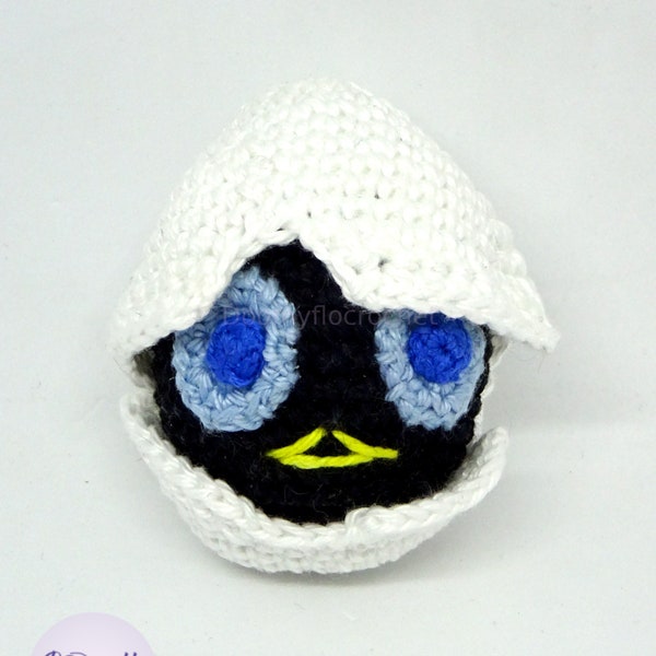 Black chick in egg shell with cotton hook; inspired by Calimero cartoon