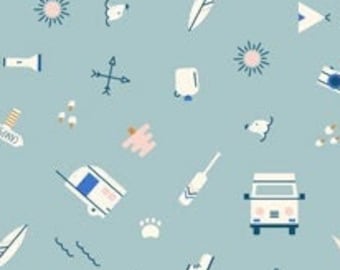 May include: A light blue fabric with a repeating pattern of camping-themed illustrations. The design includes white and blue camper vans, compasses, trees, and other outdoor elements. The ruler at the bottom shows measurements in inches.