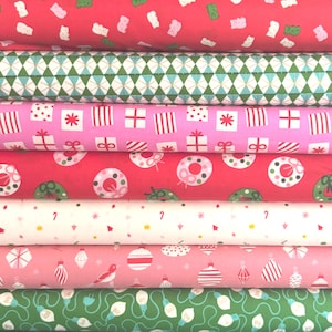 May include: A stack of seven fabric bolts featuring holiday patterns including red with gummy bears, green geometric diamonds, pink with gift boxes, red with wreaths, white with candy canes, pink with ornaments, and green with string lights.