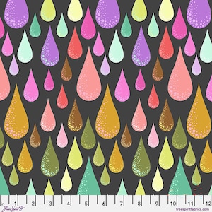 May include: A dark gray fabric featuring a repeating pattern of multicolored teardrop shapes in shades of purple, pink, yellow, green, orange, and brown. Each teardrop includes a dotted texture. A ruler at the bottom shows 12 inches.