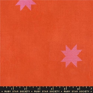 May include: Bright orange fabric with a repeating pattern of pink stars. The fabric has a textured appearance. The text "RUBY STAR SOCIETY" is printed along the bottom edge.