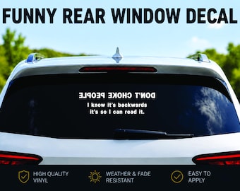 May include: A white car's rear window displays a black decal with white text that reads "DON'T CHOKE PEOPLE. I know it's backwards it's so I can read it." The words "FUNNY REAR WINDOW DECAL" are at the top. The decal is made of high-quality vinyl and is weather and fade resistant.