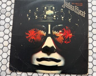 Judas Priest record. He’ll Bent on Leather ‘N’ Roll. Vintage vinyl LP.