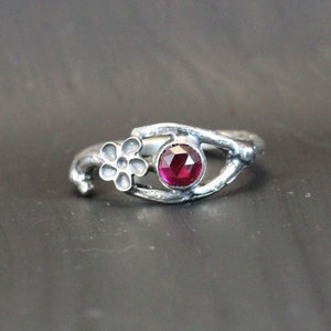 A Womans Silver Ruby Flower Twig  Ring