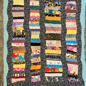 Handmade Scrappy Baby Quilt: Whimsical Flannel Backing (51x42)