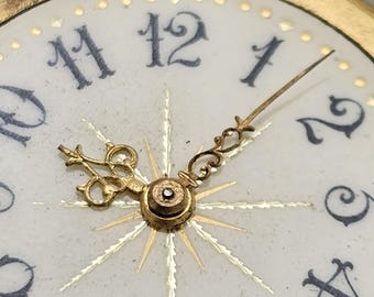 Remains of a small watch with fancy dial.
