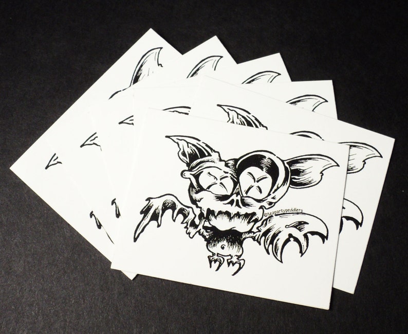 Black and White Vinyl Stickers Original Design of Cartoon Bat with Abstract Wings and Wild Eyes!