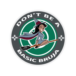May include: A round sticker with a gray background and white border. The sticker features a cartoon witch flying on a broomstick with the text "Don't be a basic bruja" in white letters.