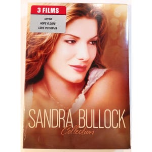 May include: A DVD collection box set featuring a portrait of Sandra Bullock on the cover. The text reads SANDRA BULLOCK Collection and a red and grey label indicates 3 FILMS including SPEED, HOPE FLOATS, and LOVE POTION #9 in white text.
