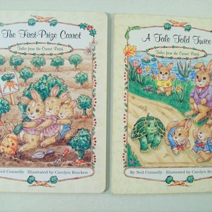 May include: Two children's books with illustrated covers featuring bunnies and the text "The First Prize Carrot Tales from the Carrot Patch" and "A Tale Told Twice Tales from the Carrot Patch".