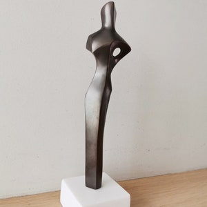 Abstract figure sculpture, solid brass, brute minimalist aesthetic, oxidised brass woman figure on marble image 7