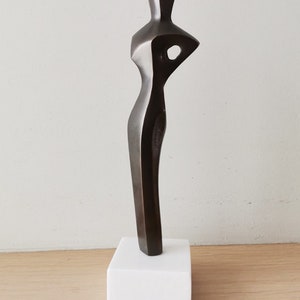 Abstract figure sculpture, solid brass, brute minimalist aesthetic, oxidised brass woman figure on marble image 8