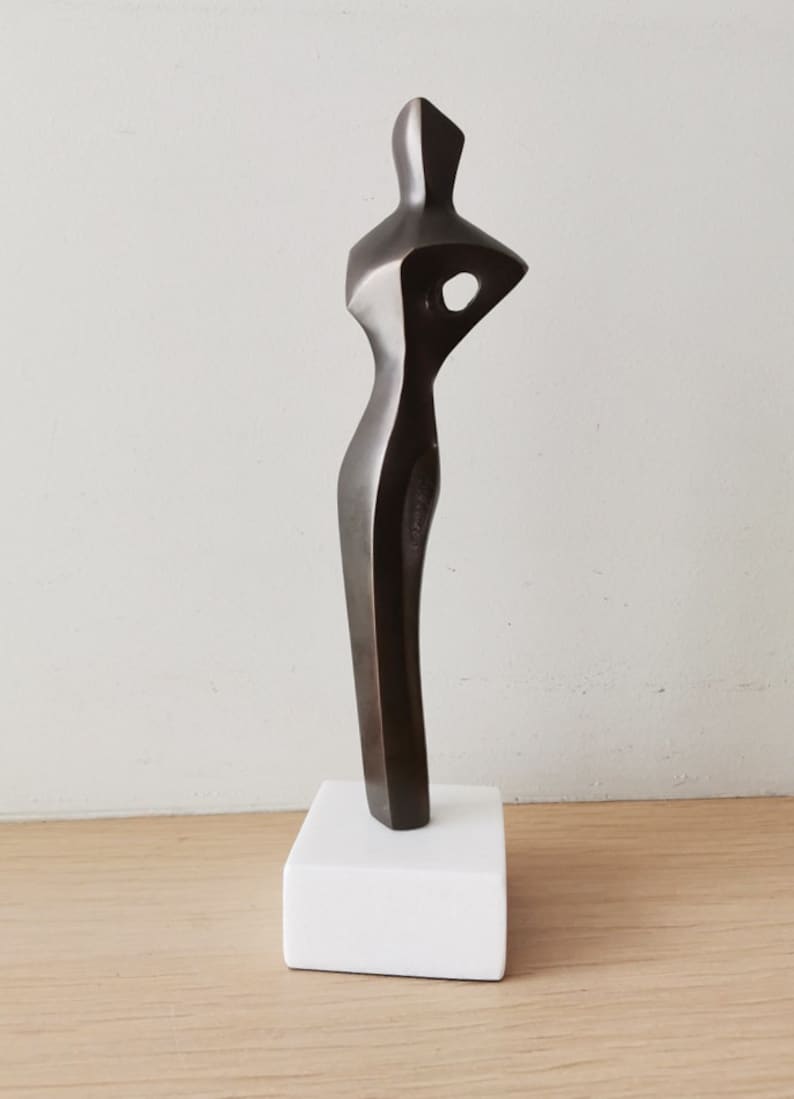 Abstract figure sculpture, solid brass, brute minimalist aesthetic, oxidised brass woman figure on marble image 8