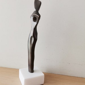 Abstract figure sculpture, solid brass, brute minimalist aesthetic, oxidised brass woman figure on marble image 4