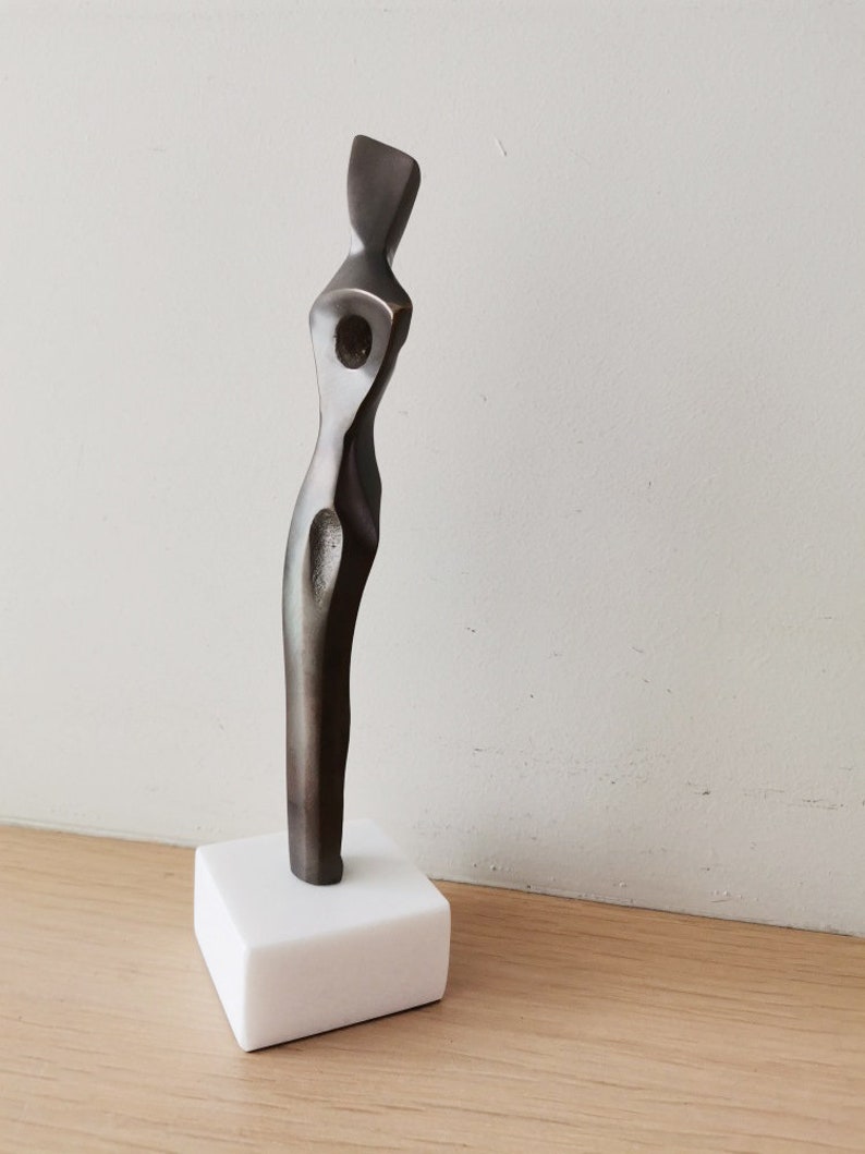 Abstract figure sculpture, solid brass, brute minimalist aesthetic, oxidised brass woman figure on marble image 4