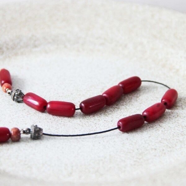 Bull's horn worry beads, red, tubular beads in open worry beads-mala, Greek begleri set with berry red bulls horn beads and sterling silver