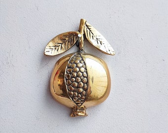 Vintage pomegranate with seeds, brass pomegranate on a leafy twig, half pomegranate, golden fruit sculpture