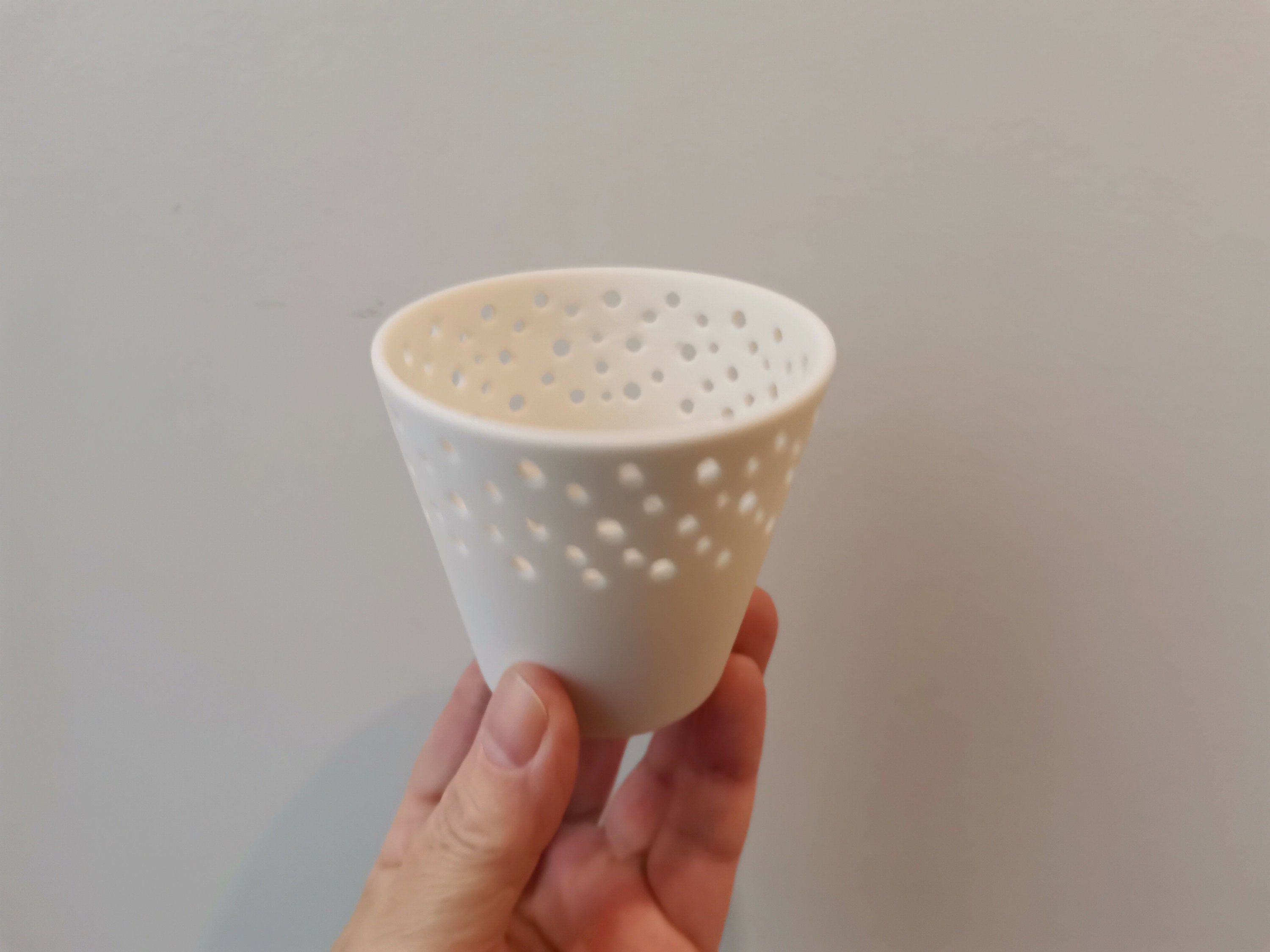 Porcelain tea light, perforated, porcelain tea light holder, white
