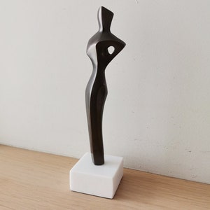Abstract figure sculpture, solid brass, brute minimalist aesthetic, oxidised brass woman figure on marble image 9