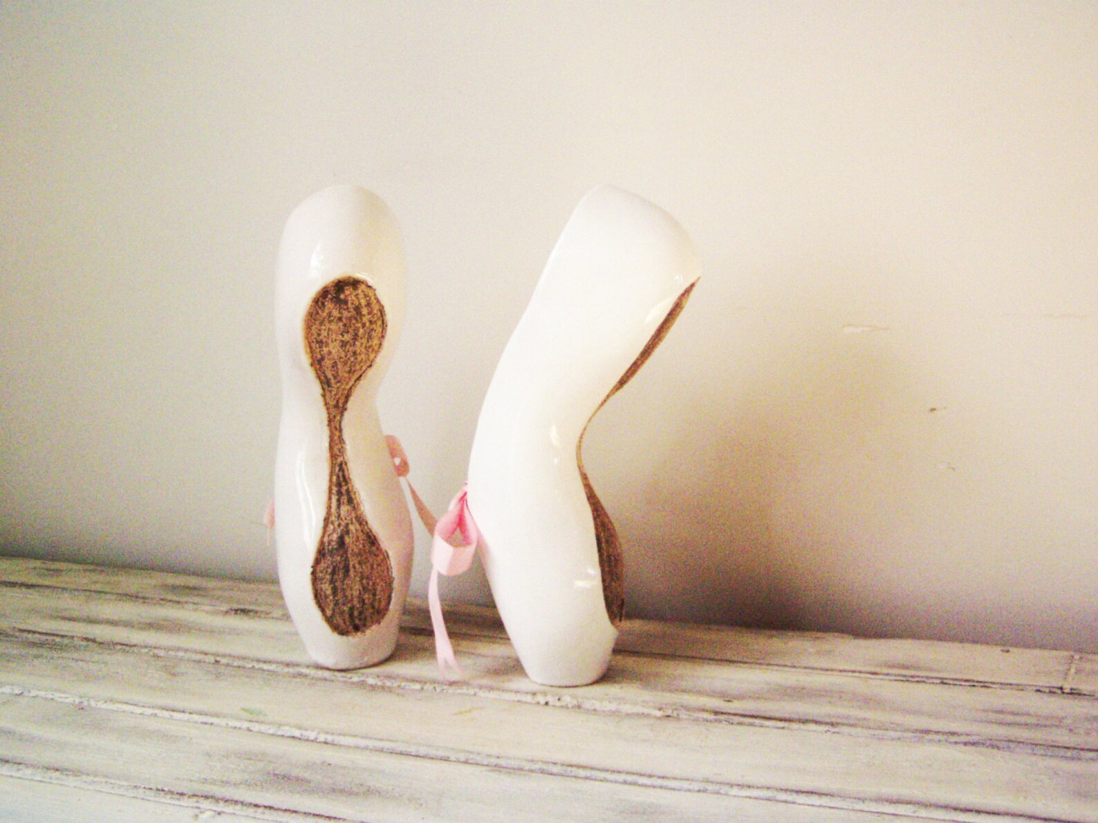 ballerina shoes sculpture, ceramic ballerina shoes of high fire, stoneware clay in milky white with satin, pink ribbons, ballet