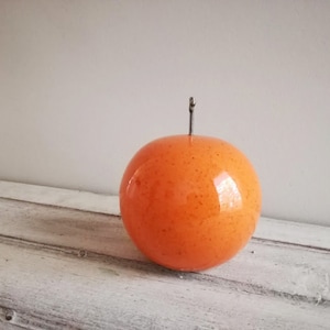 Ceramic orange sculpture, orange fruit in bright orange, earthenware clay orange with black, metal stem image 1