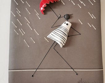 Rain wall hanging, red umbrella and figure in grey background, ceramic wall tile with figure holding red umbrella