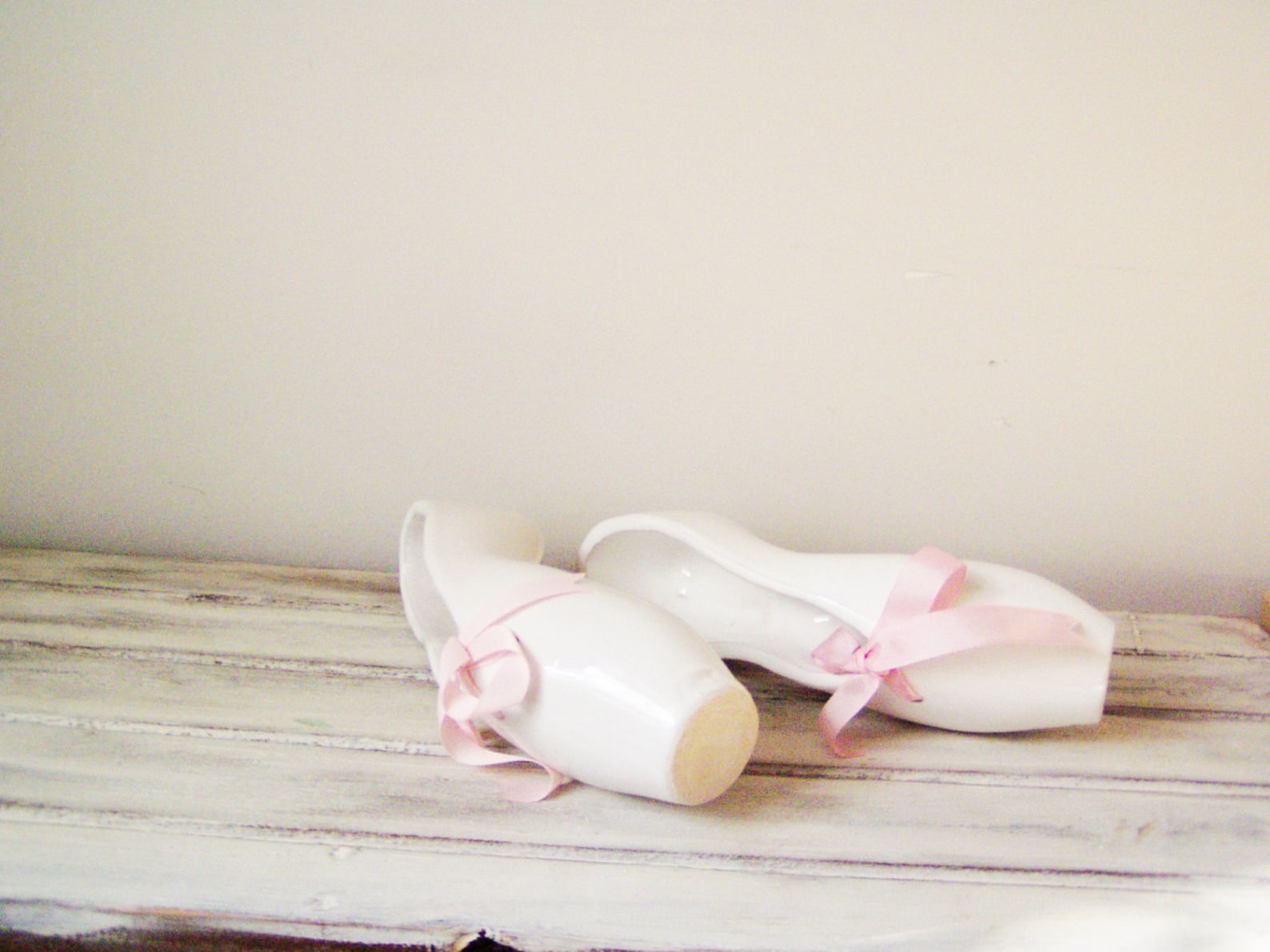 ballerina shoes sculpture, ceramic ballerina shoes of high fire, stoneware clay in milky white with satin, pink ribbons, ballet