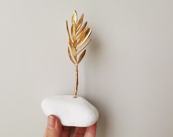 Gold olive branch sculpture, olive twig on white stone, Greek olive branch, electroplated with gold