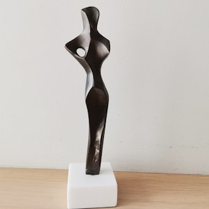 Abstract figure sculpture, solid brass, brute minimalist aesthetic, oxidised brass woman figure on marble image 5