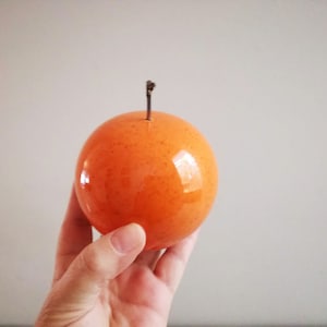 Ceramic orange sculpture, orange fruit in bright orange, earthenware clay orange with black, metal stem image 2