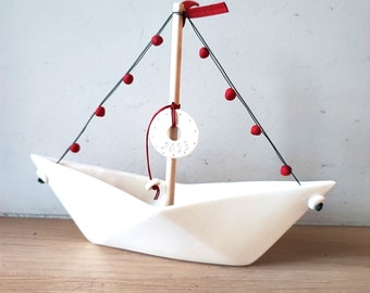 Porcelain boat sculpture, white sailboat figure with wooden mast and new year charm