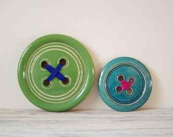 Green button sculpture, wall sculpture emerald green button, earthenware clay button with green glaze, Greek pottery, decorative wall button