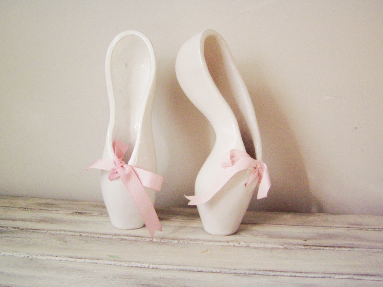 ballerina shoes sculpture, ceramic ballerina shoes of high fire, stoneware clay in milky white with satin, pink ribbons, ballet