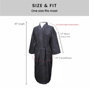 May include: A dark gray robe with a belt, showing measurements for length, sleeve, and circumference in inches. The text "SIZE & FIT" and "One size fits most" is displayed above the robe.