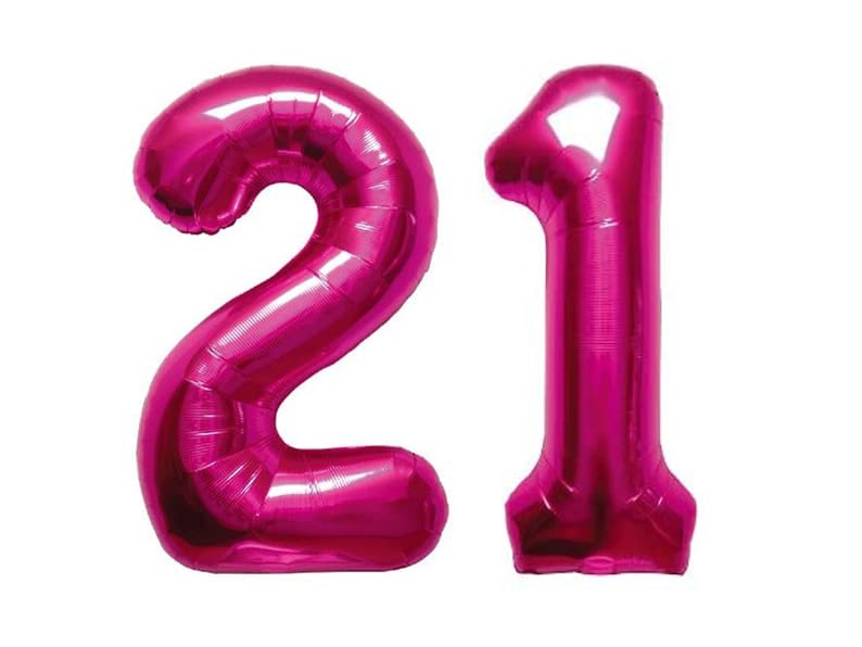 May include: Two large pink foil balloons, one shaped like the number 2 and the other shaped like the number 1, forming the number 21.