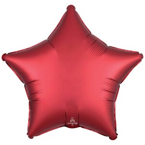 May include: A large, red star-shaped balloon with a matte finish. The balloon has five points and is inflated. The brand name "Anagram" is printed on the balloon.