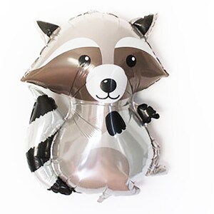 May include: A silver and brown balloon shaped like a raccoon with black and white stripes on its tail. The raccoon has a black nose and black eyes.