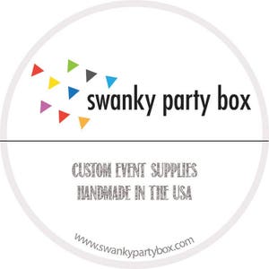 May include: A white circle with a logo for "swanky party box" in black text. The logo is surrounded by a cluster of colorful triangles. Below the logo, the text "CUSTOM EVENT SUPPLIES HANDMADE IN THE USA" is in gray text. The website address "www.swankypartybox.com" is at the bottom of the circle.