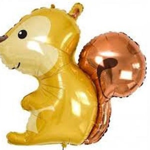May include: A gold and brown foil balloon shaped like a squirrel. The squirrel has a large, bushy tail and a cute cartoon face.