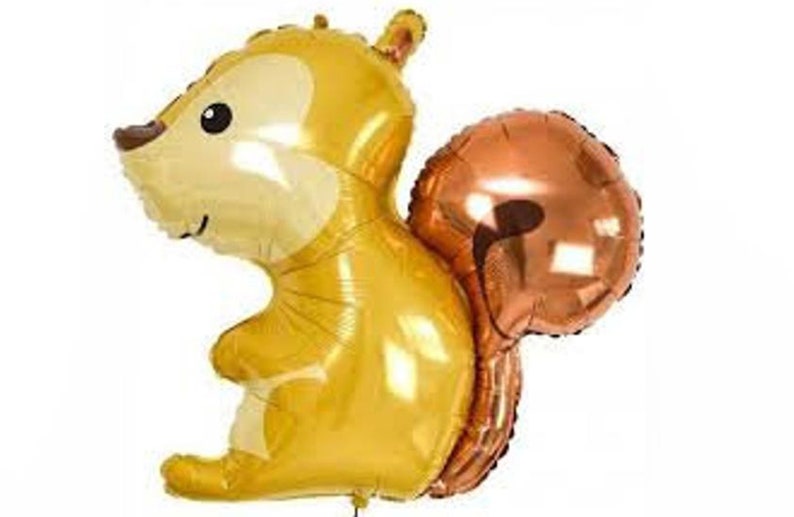 May include: A gold and brown foil balloon shaped like a squirrel. The squirrel has a large, bushy tail and a cute cartoon face.