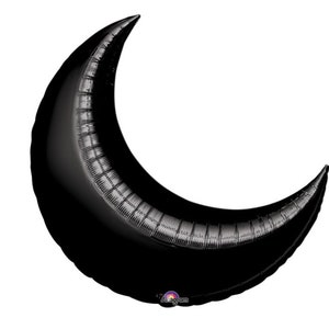 May include: A black crescent moon shaped balloon.